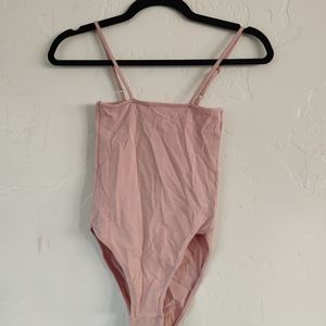 Pink body suit